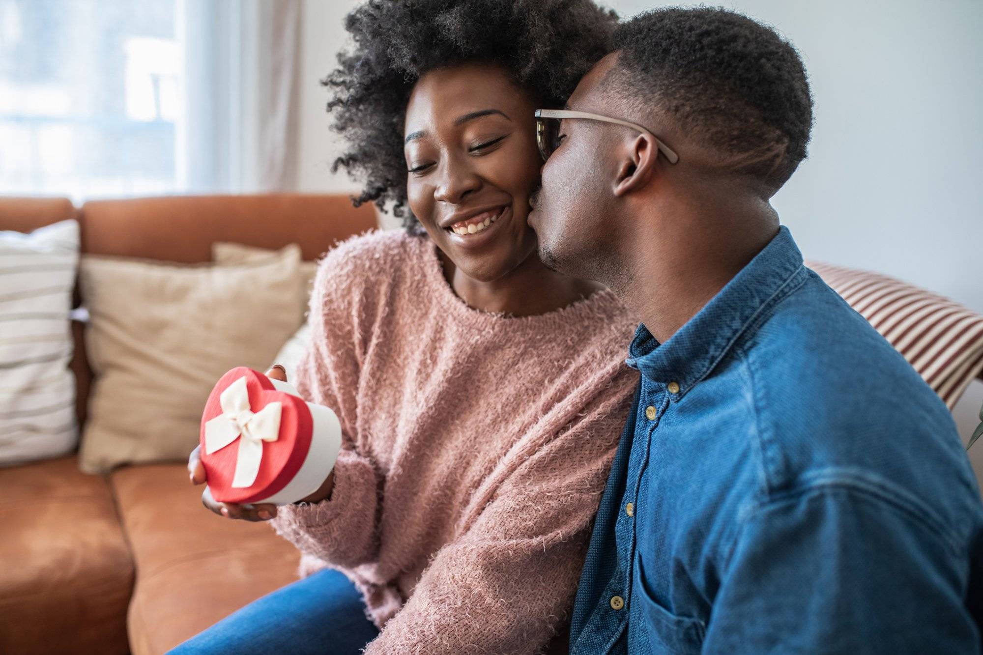 Romantic man giving a love present to his girlfriend